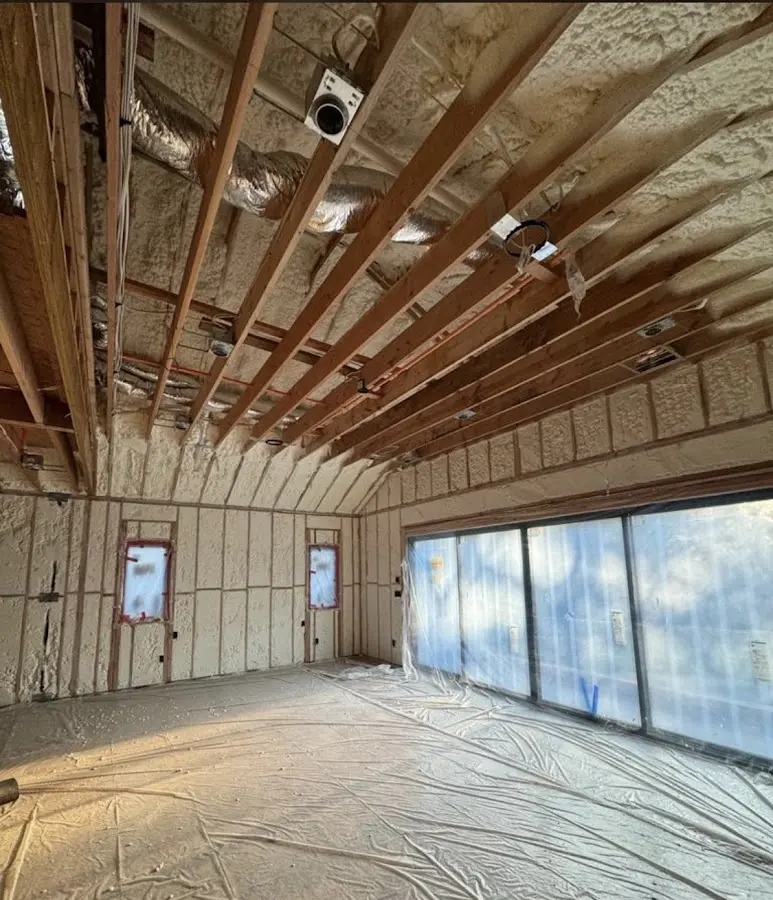 Interior walls and ceiling insulated with spray foam during new construction in Lynn Haven